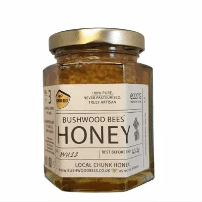 Pure local honey comb in a jar of award winning local liquid honey
